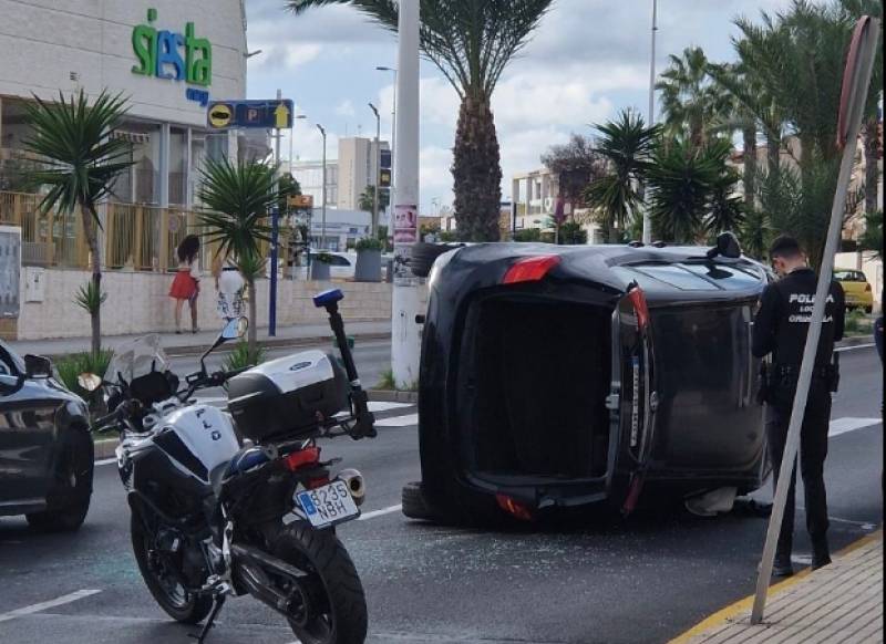 Dramatic scenes as car flips over outside busy Orihuela Costa bar